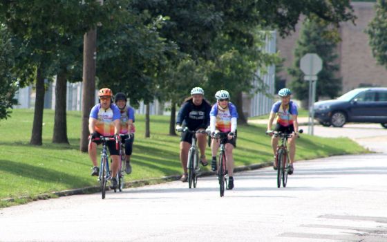 The final five Cycling with Sisters riders arrive at their destination Sept. 11 in South Bend, Indiana, after a 60-mile ride from Chesterton to draw attention to the social justice work of Catholic women religious. (Nick Schafer)