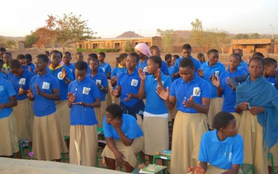 Girls being educated by the Sisters of the Immaculate Conception in Burkina Faso attend a school assembly. (Courtesy of Sr. Marguerite Kankouan)