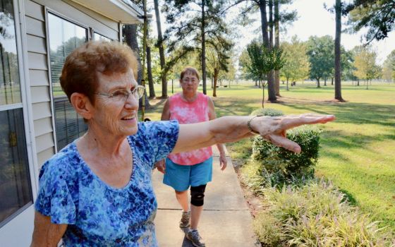 Dwelling Place Sr. Clare Van Lent shows the grounds of the community's retreat center in Brooksville, Mississippi, in September 2019. Behind her is Sr. Mary Horrell. (GSR photo / Dan Stockman)