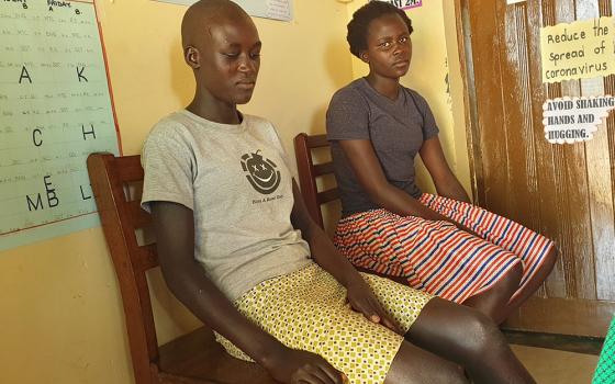 Esther Nangiru, left, and Susan Cherotich are victims of forced marriage who are taking refuge at Kalas Girls Primary School in Amudat, northern Uganda. (Gerald Matembu)