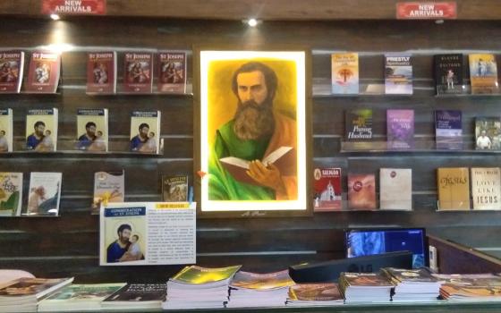 A painting of St. Paul hangs behind the counter at the Pauline Book Centre in Panaji, Goa, in India. The feast day of St. Paul is June 29. (Courtesy of Lissy Maruthanakuzhy)