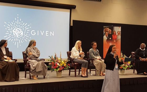 Sr. Maria Juan Anderson of the Religious Sisters of Mercy of Alma, Michigan, introduces the panelists at a session about consecrated life June 12 at the Given forum at the Catholic University of America in Washington, D.C. The panelists are, from left, Sr