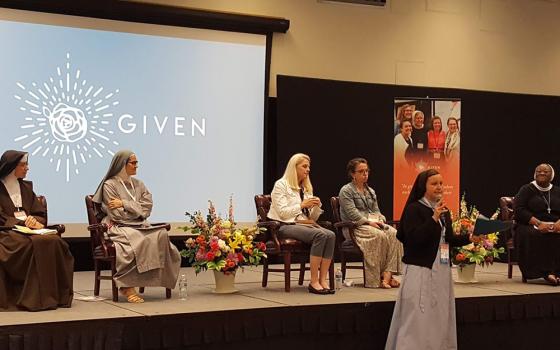 Sr. Maria Juan Anderson of the Religious Sisters of Mercy of Alma, Michigan, introduces the panelists at a session about consecrated life June 12 at the Given forum at the Catholic University of America in Washington, D.C. The panelists are, from left, Sr