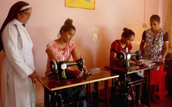 Sr. Lourenca Marques, a member of the Congregation of the Sisters of Holy Family of Nazareth, observes training in stitching with teacher Mary Fernandes (far right) at Asha Sadan at Baina in the western Indian state of Goa. (Lissy Maruthanakuzhy)