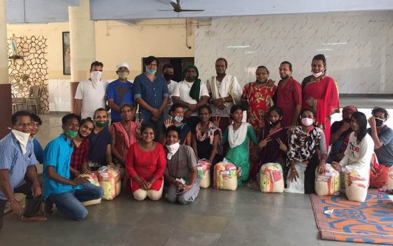 After a shared meal at the Canossa campus in Mumbai, India, transgender guests receive provisions to support them during the pandemic. (Provided photo)