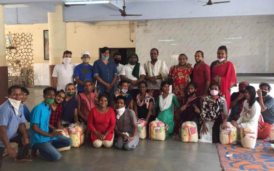 After a shared meal at the Canossa campus in Mumbai, India, transgender guests receive provisions to support them during the pandemic. (Provided photo)