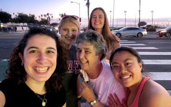 From left: Nina Dorsett, Emily Michaelis, Sr. Louise Ann Micek, Emma Shay, and I are pictured in a selfie. We ate at a restaurant in downtown San Diego after our service with migrants to reflect about our experiences. (Courtesy of Sisters of St. Joseph)
