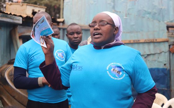 Sr. Virginia Njeri of the Religious of the Assumption talks to residents of Kawangware, a low-income residential area in Nairobi, July 22. The sisters conduct peace campaigns to urge residents to maintain peace and avert violence during elections. (GSR)