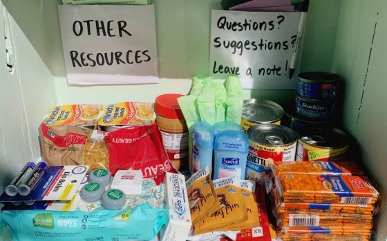 The Little Free Pantry in front of the Denver Loretto Volunteer House is stocked with dry food products and personal hygiene products like deodorant, menstrual care items, toothpaste and wipes. (Ali Alderman)