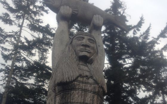 A totem called "Ko-kual-alwoot" ("Maiden of the Sea"), carved by a Swinomish tribal member, stands near Deception Pass at Rosario Beach on the coast of Puget Sound, a few miles from the Suquamish Reservation. (Courtesy of The Cedar Tree Institute)