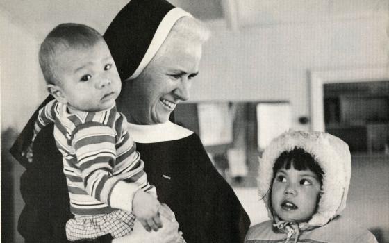 St. Joseph Sr. Mary Christine Taylor, a Sister of St. Joseph of Watertown, New York, with two children from the Mohawk Tribe on the St. Regis Mohawk Reservation in 1984 (Courtesy of Catholic Extension Magazine)