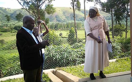 Sr. Mary Grace Akiror, right, points out some detail while inspecting government projects in western Uganda. (Gerald Matembu)