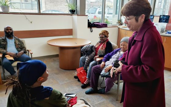 Mercy Sr. Mary Scullion, one of the co-founders of Project HOME in Philadelphia, meets clients at a Project HOME medical facility in December. (GSR photo/Chris Herlinger)
