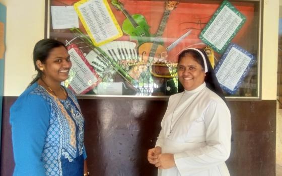 Sr. Meena Dias, a member of the Sisters of Holy Family of Nazareth, right, with Vandana Kawlekar, a staff member at St. Xavier's Academy, which cares for children with disabilities in Old Goa, ancient capital of Portuguese Goa (Lissy Maruthanakuzhy)