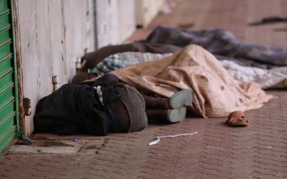 Homeless children sleep, huddling close to increase warmth, on the streets of Nairobi, Kenya. They will take turns staying awake to fend off the dangers that often appear in the darkness. (GSR file photo)