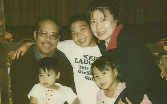 My family in 2006. From left: Osmundo Evangelista Jr. (my papa), holding Jenalyn Evangelista (my baby sister); Joseph Evangelista (my older brother); and Maria Ignacio (my mom), holding me. (Courtesy of Jaesen Evangelista)