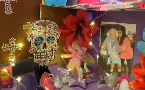 A student shares her ofrenda altar in memory of her grandmother during a Dia de los Muertos virtual gathering of the Incarnate Word family last fall. (Screenshot by Martha A. Kirk)
