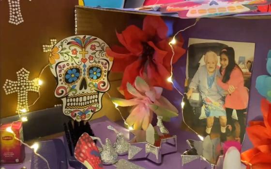 A student shares her ofrenda altar in memory of her grandmother during a Dia de los Muertos virtual gathering of the Incarnate Word family last fall. (Screenshot by Martha A. Kirk)