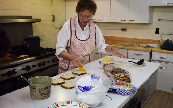 Sr. Patricia Bietsch prepares grilled cheese sandwiches in the St. Mary Mission hall kitchen, February 2016 in Tohatchi, New Mexico. (Julie A. Ferraro)