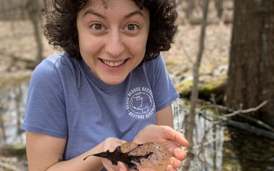 Eyes wide, Julia marvels at the amphibian eggs she's holding, exploring the first signs of new life in vernal pools during springtime in Nazareth, Kentucky.