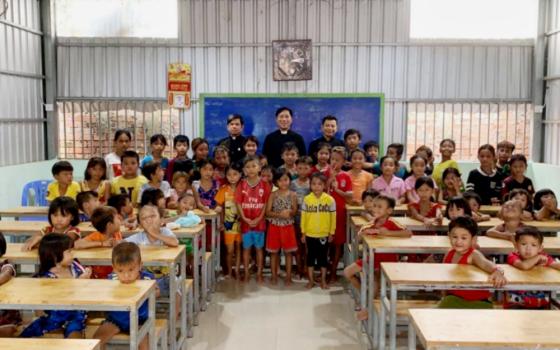 Br. Joseph Nguyen Thanh Tung, center, with the Vietnamese children in the class in Cambodia (Provided photo)