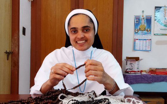 Sr. Rini Rose of the Sisters of the Adoration of the Blessed Sacrament makes rosaries at her community's convent in Ambalavayal, Kerala, India. (Courtesy of the Sisters of the Adoration of the Blessed Sacrament)