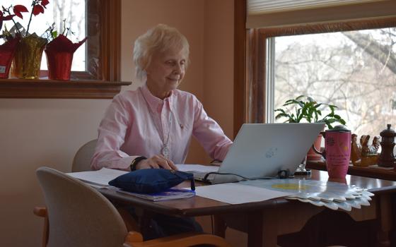 Sr. Suzanne Susany of the Sisters of St. Francis of the Neumann Communities assists immigrants from home in Pittsburgh during the pandemic. (Julie A. Ferraro)