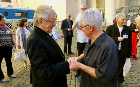 Tom Stang, right, meets retired Bishop Erwin Kräutler of Xingu, Brazil, at the Vatican's synod for the Amazon. Kräutler, a longtime environmental defender in the Amazon, was an ally of Notre Dame de Namur Sr. Dorothy Stang and presided at her funeral.
