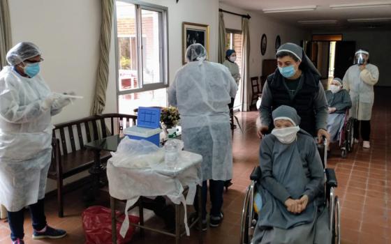 Sisters and staff of the Institute of the Sister Servants of the Heart of Jesus in Córdoba, Argentina, care for elderly sisters. Congregations around the world tried to protect their elderly and vulnerable members from the COVID-19 virus. (Courtesy of the