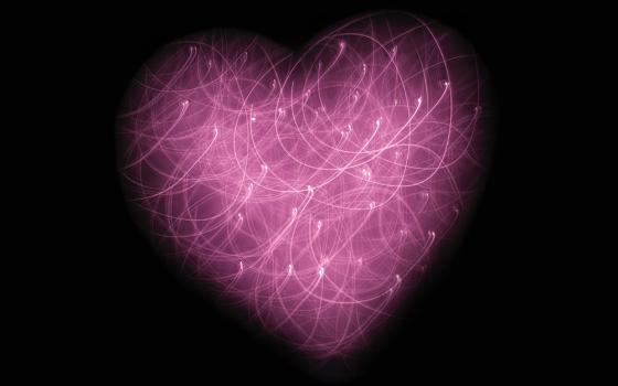 Heart image made of points of light (Unsplash/Jude Beck)