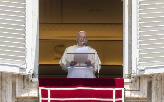Pope Francis delivers his blessing as he recites the Regina Coeli noon prayer from the window at the Vatican, Sunday, May 22, 2022. (AP Photo/Andrew Medichini)