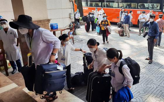 Women and men religious arrive on Aug. 20 at Minh Tam Hotel, where they will stay while serving COVID-19 patients at local hospitals in Ho Chi Minh City, Vietnam. (Joachim Pham)