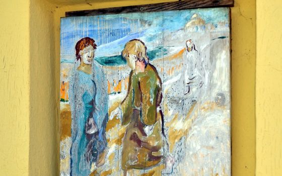 At a wayside shrine in Wipfing, Austria, a painting by Albert Huspeka depicts the journey of the disciples to Emmaus. (Wikimedia Commons/Herzi Pinki)