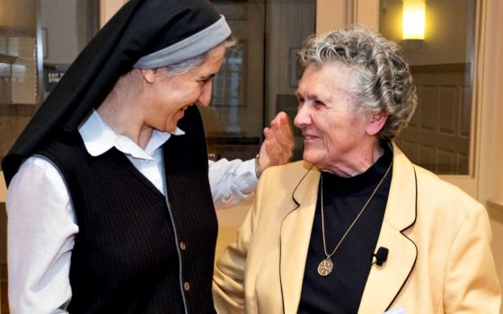 Benedictine Sr. Teresa Forcades, left, talks with Benedictine Sr. Joan Chittister at the Women's Ordination Conference's Oct. 11 event, "Radicals and the Rule," in Washington, D.C. (Women's Ordination Conference / Anna Romanovsky)