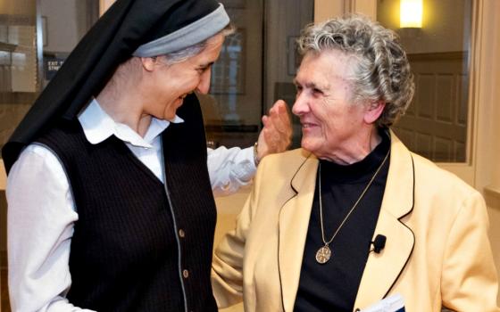 Benedictine Sr. Teresa Forcades, left, talks with Benedictine Sr. Joan Chittister at the Women's Ordination Conference's Oct. 11 event, "Radicals and the Rule," in Washington, D.C. (Women's Ordination Conference / Anna Romanovsky)