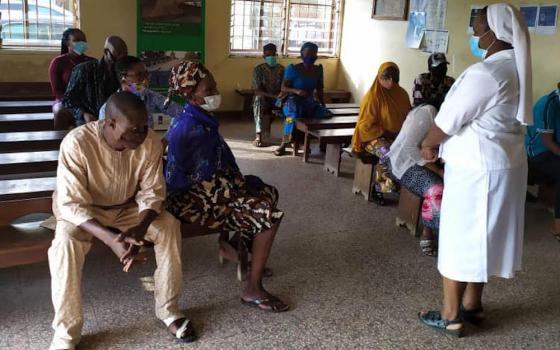 Notre Dame de Namur Sr. Prisca Igbozulike holds a COVID-19 awareness workshop for her patients at St. Catherine of Siena Medical Centre in Lagos, Nigeria. (Patrick Egwu)