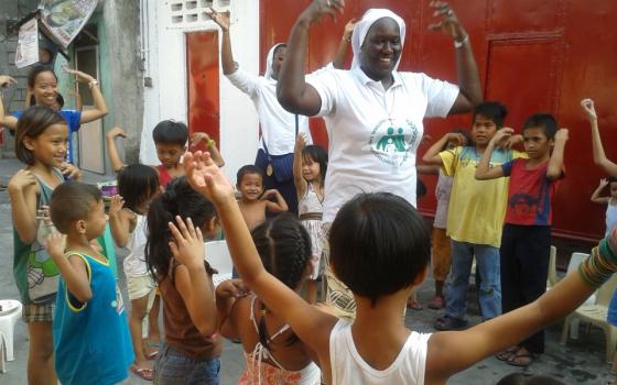 Sisters of Our Lady of the Immaculate Conception of Castres work with children from depressed areas at Emilie's Home in Quezon City, Philippines, in 2014. (Provided photo)