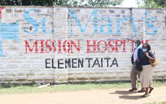 Patients seeking medical care walk towards the main entrance of St Mary's Mission Hospital Elementaita in Gilgil, in southwestern Kenya. This is a branch hospital of St. Mary’s Mission Hospital in Lang’ata, Nairobi. Patients of the hospitals say they are 