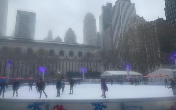 Snow begins to fall on Bryant Park's ice-skating rink in New York City. (Celina Kim Chapman)