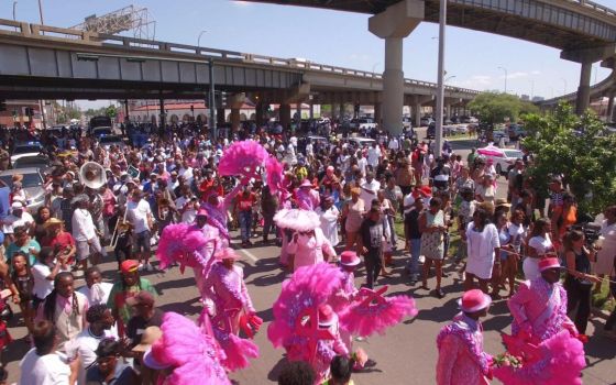 Members of the Original Big 7 social aid and pleasure club second-line in a scene from director Jason Berry's 2021 jazz funeral documentary "City of a Million Dreams." (Courtesy photo)