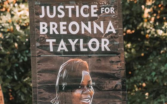 A protester holds up a sign calling for justice for Breonna Taylor at a Black Lives Matter protest in Atlanta. (Photo by Maria Oswalt on Unsplash)