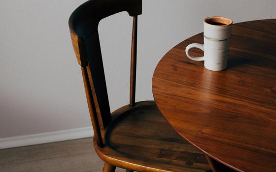 At the table (Unsplash/Ryan Riggins)