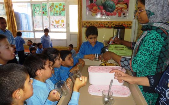 Sister Razia serves ice cream to the children at snack time at Pro Bambini di Kabul, a school for children with disabilities in Kabul, Afghanistan, in 2015. 