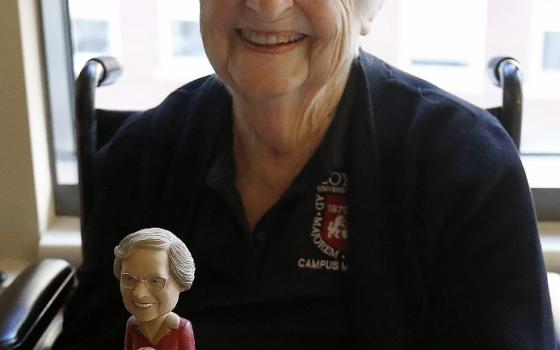 Sr. Jean Dolores Schmidt holds a bobblehead made in her likeness while recuperating from hip surgery in January 2018.