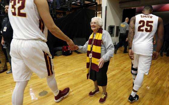 Sr. Jean Dolores Schmidt greets Loyola University Chicago men's basketball players after a Feb. 12, 2018, game. (CNS/Chicago Catholic/Karen Callaway)