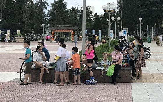 Children and their parents play in a park in Nha Trang, Vietnam, after a COVID-19 lockdown was lifted on Oct. 17. (Joachim Pham)