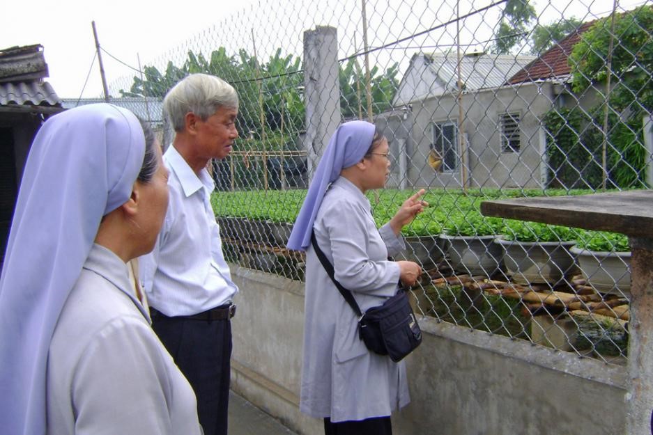 Sisters display new ways to grow vegetables on a farm in Vietnam.