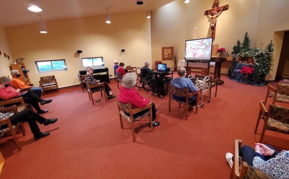 The Benedictine Sisters of St. Scholastica Monastery in Chicago, Illinois, attend a virtual concert in the chapel in the infirmary wing. One of the community's oblates played piano and sang for the sisters. (Belinda Monahan) The Benedictine Sisters of St. Scholastica Monastery in Chicago, Illinois, attend a virtual concert in the chapel in the infirmary wing. One of the community's oblates played piano and sang for the sisters. (Belinda Monahan)