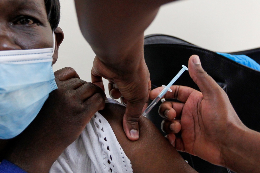 A woman receives the AstraZeneca/Oxford COVID-19 vaccine at Kenyatta National Hospital in Nairobi, Kenya, March 5. (CNS/Reuters/Monicah Mwangi)