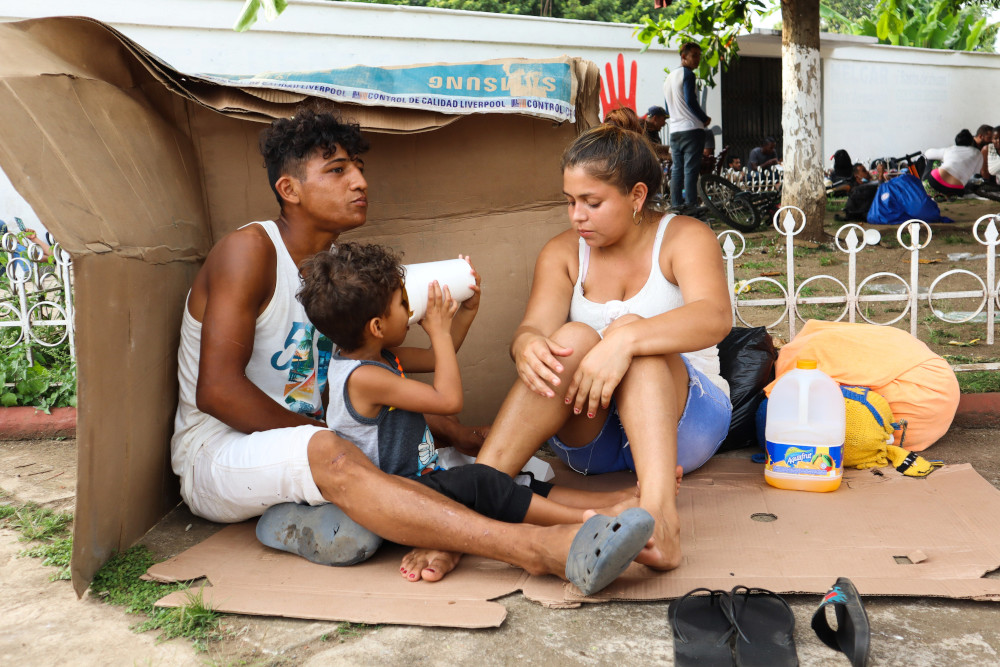 A migrant family rests at a park with other migrants in a caravan heading to the U.S. border Nov. 18 in Huehuetán, Mexico. (CNS/Reuters/Jose Torres)